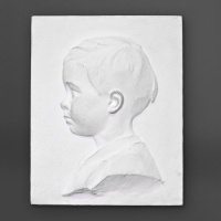 Paire de profil d’enfant en plâtre, XXème siècle.