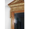 Miroir en bois et stuc doré de forme néoclassique de la fin du XIXème siècle. Miroir en bois et stuc doré de forme néoclassique de la fin du XIXème siècle.