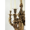 Lustre en bois sculpté et doré du XIXème siècle pour l'utilisation de l'éclairage à la bougie, 4 bras, 4 bougies. Lustre en bois sculpté et doré du XIXème siècle pour l'utilisation de l'éclairage à la bougie, 4 bras, 4 bougies.