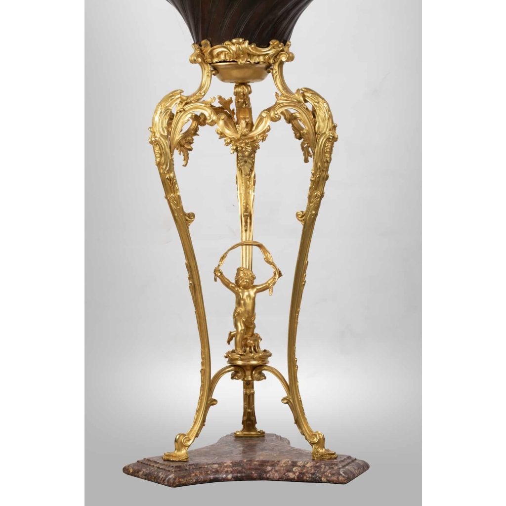 A French 19th Century Guilt and Patinated Bronze Jardinière on Stand. A French 19th Century Guilt and Patinated Bronze Jardinière on Stand.