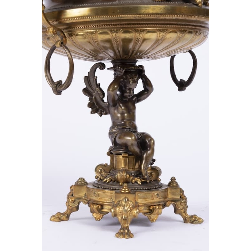 A French 19th Century Napoléon III Ormulu and Patinated Bronze Centerpiece. A French 19th Century Napoléon III Ormulu and Patinated Bronze Centerpiece.