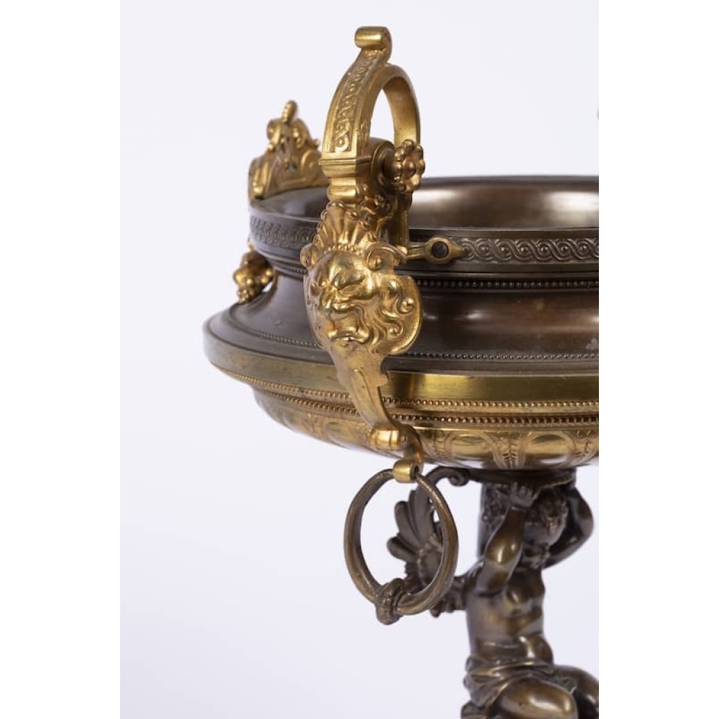 A French 19th Century Napoléon III Ormulu and Patinated Bronze Centerpiece. A French 19th Century Napoléon III Ormulu and Patinated Bronze Centerpiece.