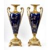 Garniture en porcelaine bleu, décor fleurs monture en bronze dorée signé Royal Bonn Garniture en porcelaine bleu, décor fleurs monture en bronze dorée signé Royal Bonn