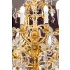 Lustre en bronze doré à 16 bras de lumière et 12 fleurettes en cristal éclairées, XIXème siècle Lustre en bronze doré à 16 bras de lumière et 12 fleurettes en cristal éclairées, XIXème siècle