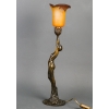 Lampe en bronze patiné représentant une femme retenant une tulipe en pâte de verre. Époque Art Nouveau vers 1900. Signée Firmin Bate Lampe en bronze patiné représentant une femme retenant une tulipe en pâte de verre. Époque Art Nouveau vers 1900. Signée Firmin Bate