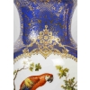 Paire de vases en porcelaine à décor d'oiseaux exotiques, travail français du début du XIXe siècle Paire de vases en porcelaine à décor d'oiseaux exotiques, travail français du début du XIXe siècle