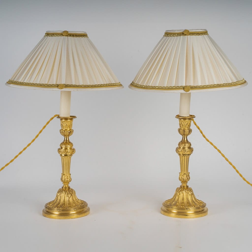 Paire de flambeaux en bronze ciselé et doré montés en lampes de style Louis XVI MLD Antiquités|MLD Antiquités|MLD Antiquités|MLD Antiquités|MLD Antiquités|MLD Antiquités|MLD Antiquités||