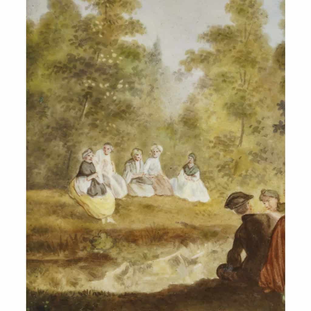 Scène galante, peinte sur porcelaine, signée G.M, travail français du XIXe siècle dans le goût de Watteau. Scène galante, peinte sur porcelaine, signée G.M, travail français du XIXe siècle dans le goût de Watteau.