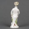 Amusant flacon de parfum en porcelaine anthropomorphe. Travail allemand du XIXe siècle, vers 1860. 