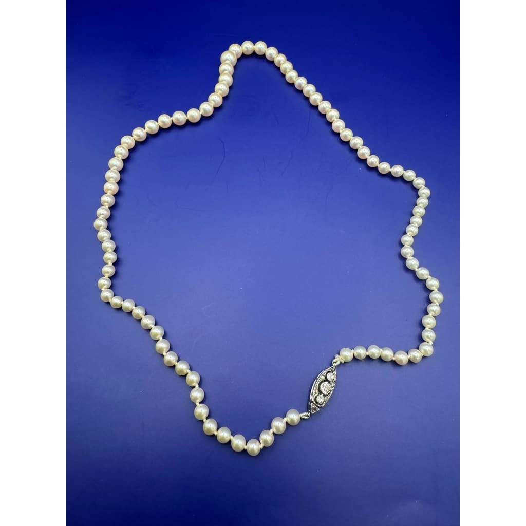 Collier de perles ancien, fermoir en or et diamants 